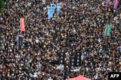 Estudiantes de la Universidad China de Hong Kong en una marcha el 2 de septiembre (Foto: Philip Fong/AFP).