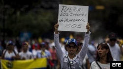 Un grupo de personas participó en una manifestación en contra del Gobierno del presidente Nicolás Maduro el domingo 16 de marzo de 2014, en el sector Chacao en Caracas, Venezuela.