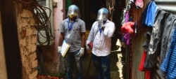 Estos trabajadores sanitarios de la India participan en una campaña de información sobre las vacunas COVID-19 en Mumbai. Foto: © UNICEF/Bhushan Koyande.