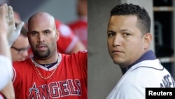 Albert Pujols (izq.) y Miguel Cabrera. 